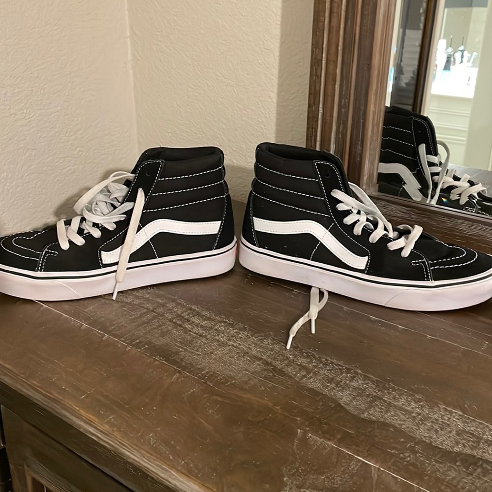 Black and white high top vans
